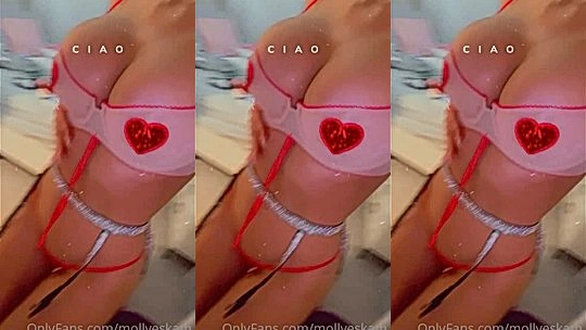 Molly Eskam teasing her big tits in her red nipple pasites