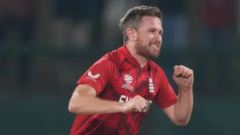 England bowler Liam Dawson celebrates taking a wicket