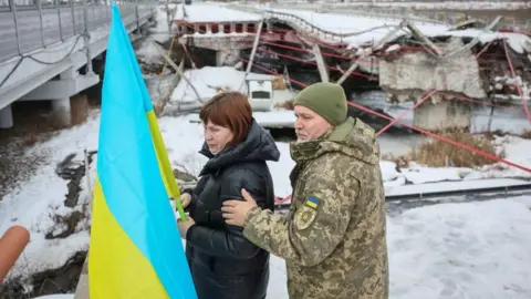 People attend a memorial event to mark the fourth anniversary of the full-scale Russian invasion