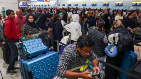 A departure board at Ben Gurion airport in Tel Aviv shows cancelled flights.
