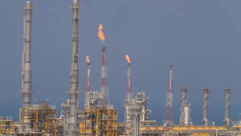 Fire blowing from chimneys at facilities at  South Pars gas field