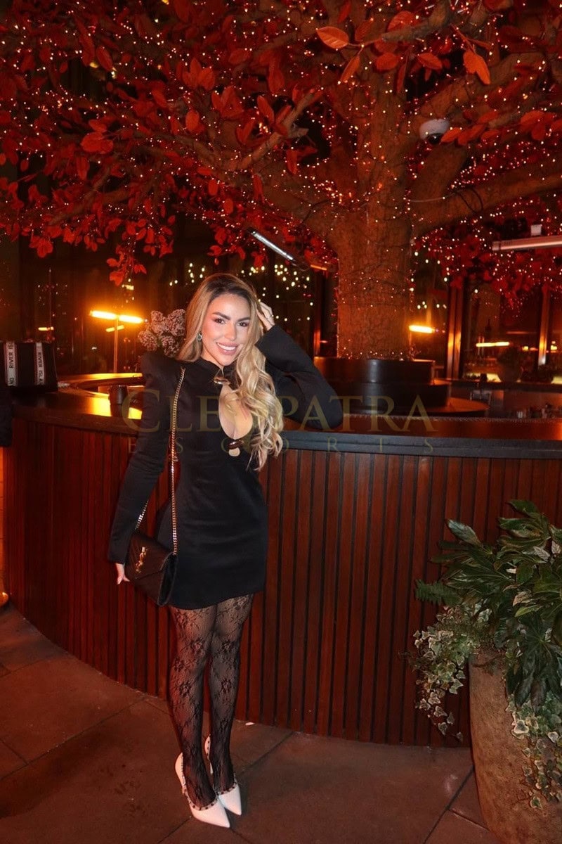 Elegant escort woman in black dress at Cleopatra Escorts Lon.