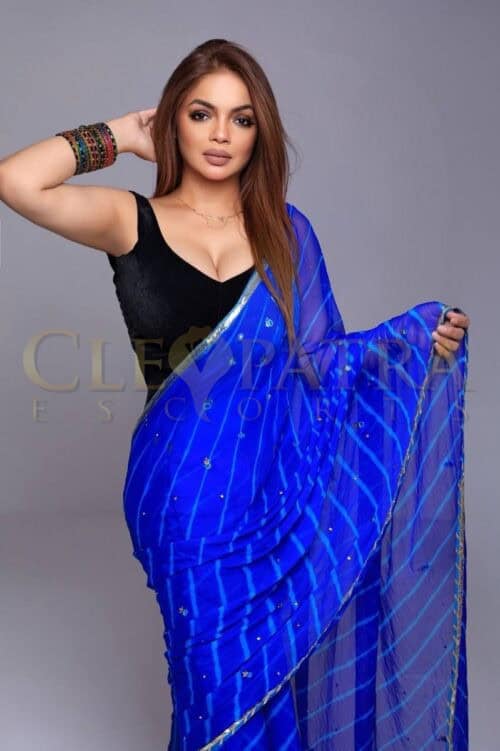 Indian woman in blue saree for escort services in London.