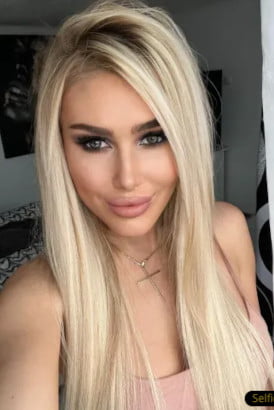 Close up selfie of a smiling blonde girl